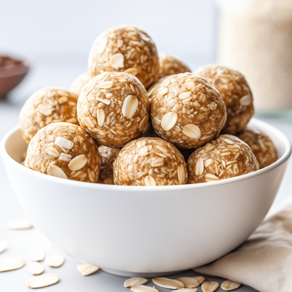 Banana peanut butter protein balls on a wooden plate with chocolate chips