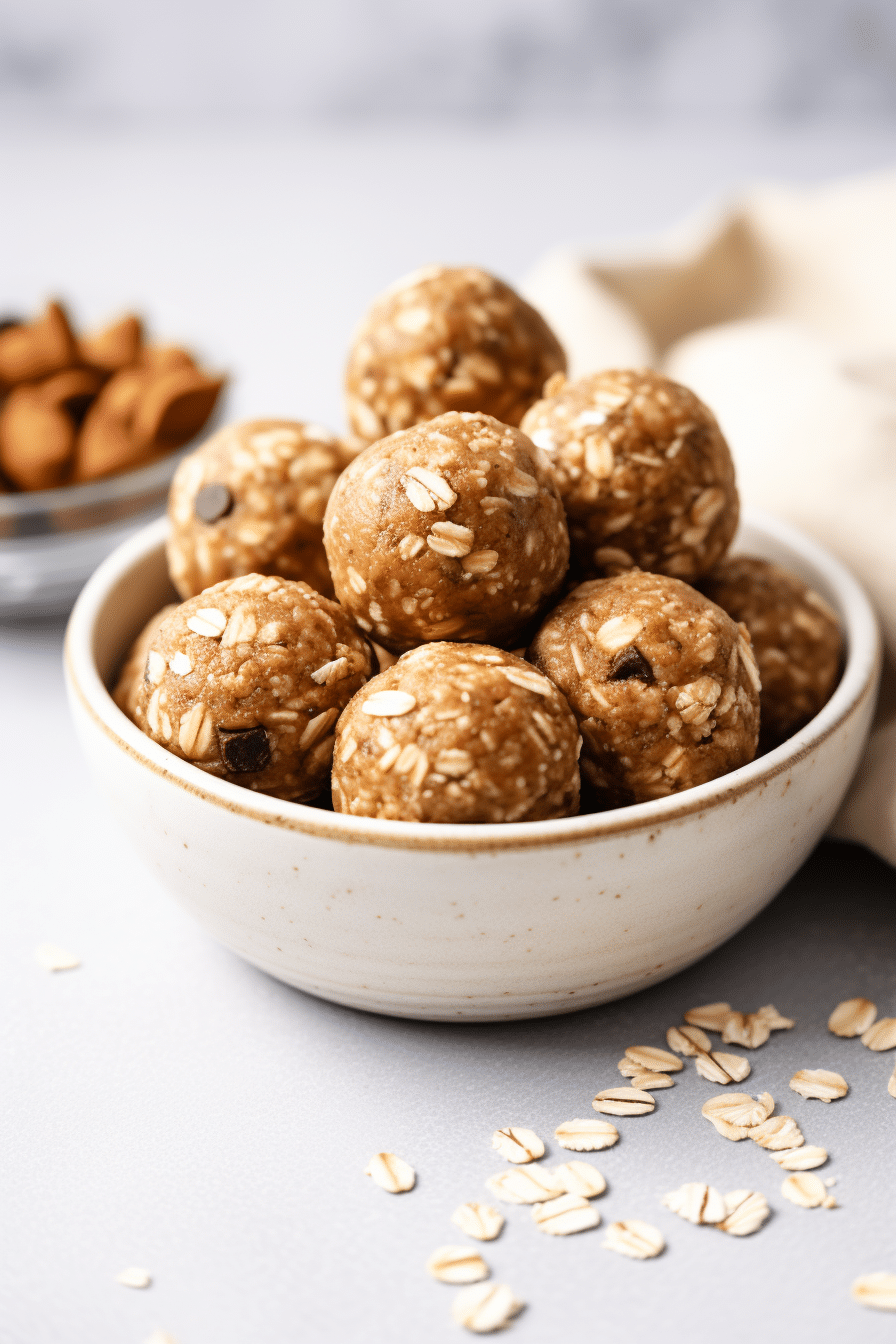 Banana Peanut Butter Protein Balls: A High-Protein, Healthy Snack for Energy and Vitality 2 Banana peanut butter protein balls on a wooden plate with chocolate chips